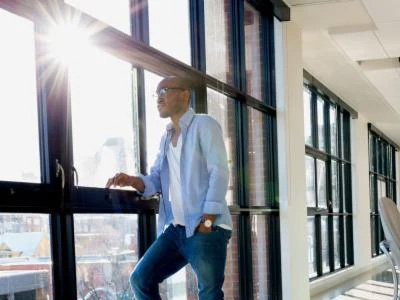 Office employee behind cooler office window with film